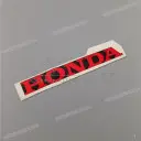 Emblemat HONDA na dolną owiewkę, lewa strona