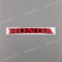 Right under cowl HONDA emblem, right side