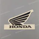 Emblema ala Honda sul serbatoio, lato sinistro