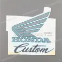 Side cover Honda wing emblem, left side