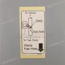 Fuel hose warning label