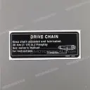 Achterbrug aandrijfketting slijtage sticker "KETTING VERVANGEN"