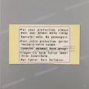 Swingarm drive caution label