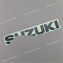 Under cowling SUZUKI emblem, left side