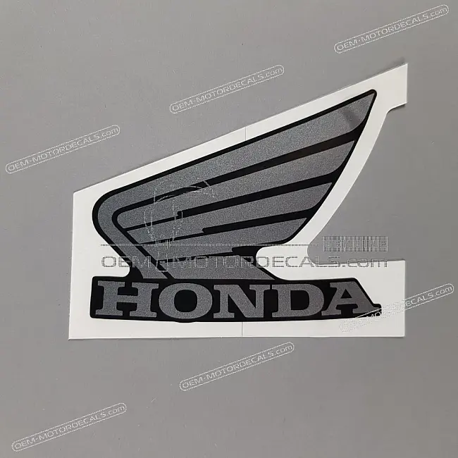 Honda CBF125 Emblema Ala Sinistra Carenatura Anteriore Sinistra OEM 64215KWF900ZA