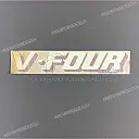 Under cowl emblem