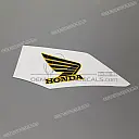 Emblema del logo Honda Wing en carenado lateral derecho