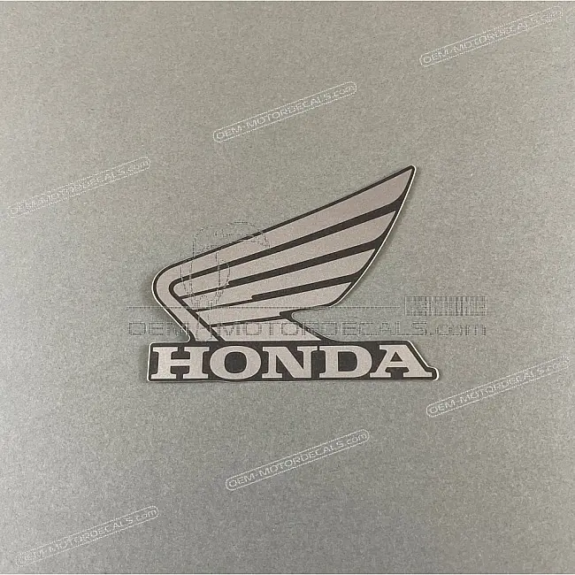 Honda CB125R Lewa owiewka Emblemat Honda Wing Lewa strona OEM 86202K98E00ZC