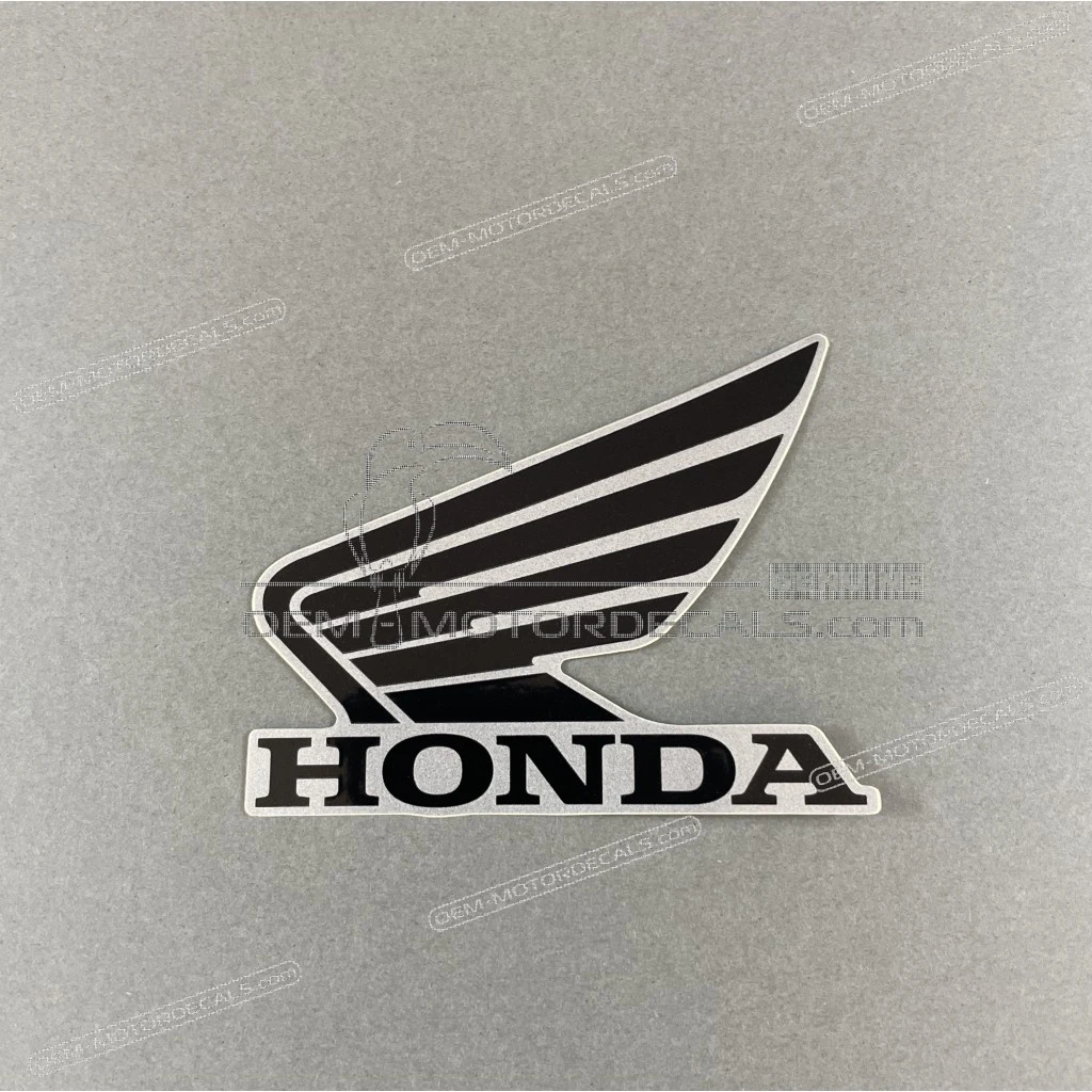 Honda CB125R Linker Flügel Honda Wing Logo Emblem linke Seite OEM 86202K98E50ZB