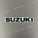 Under cowling SUZUKI emblem, left side